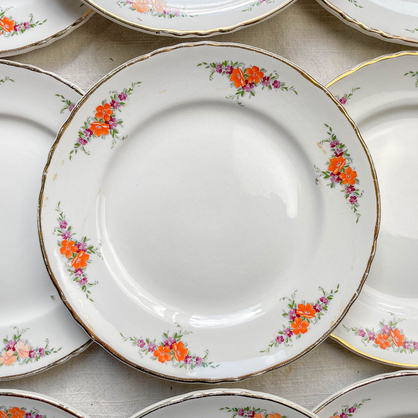9 Petites assiettes vintage Moulin des Loups motif fleuries orange