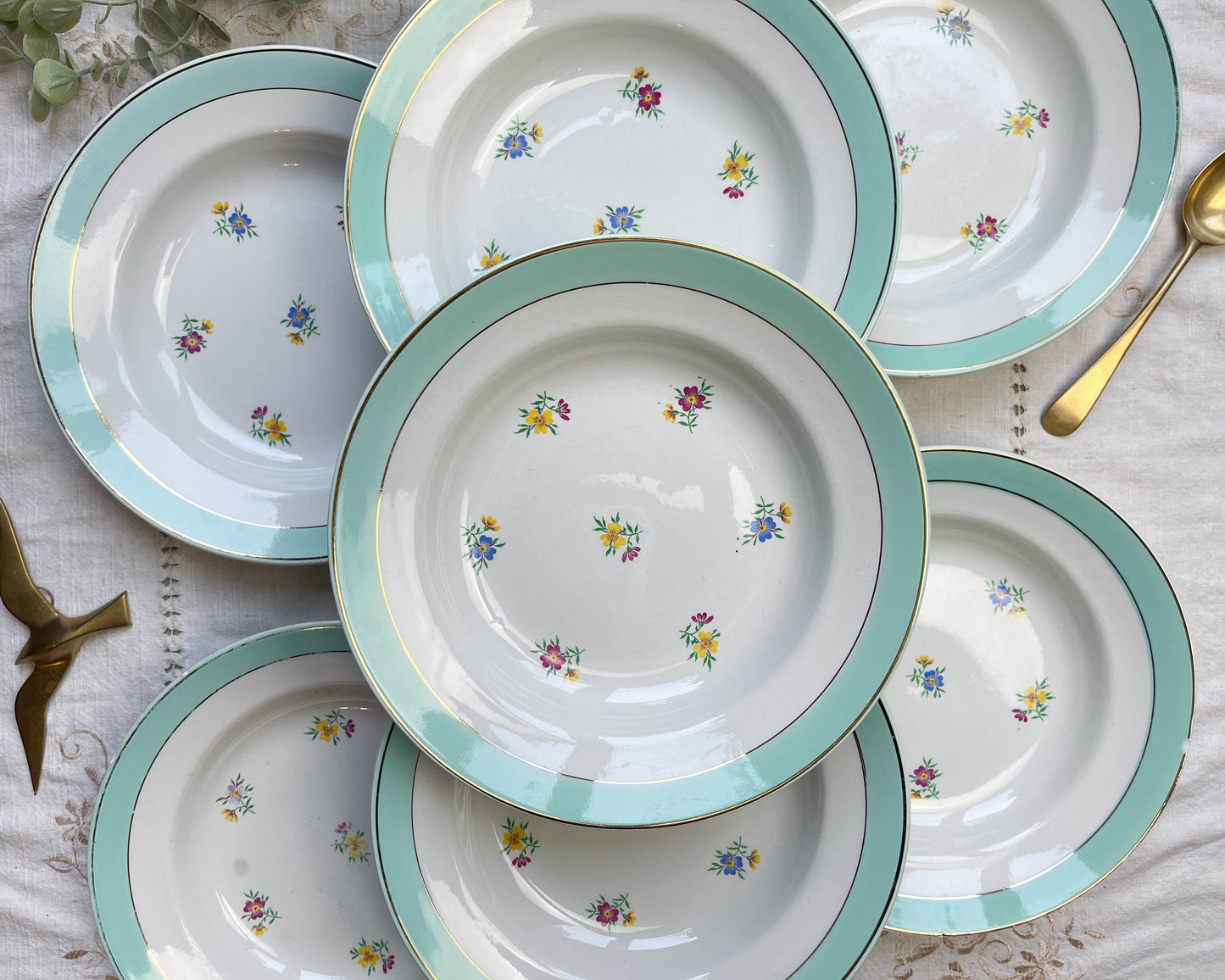7 vintage white and green floral porcelain soup plates, Lunéville, 1950s.
