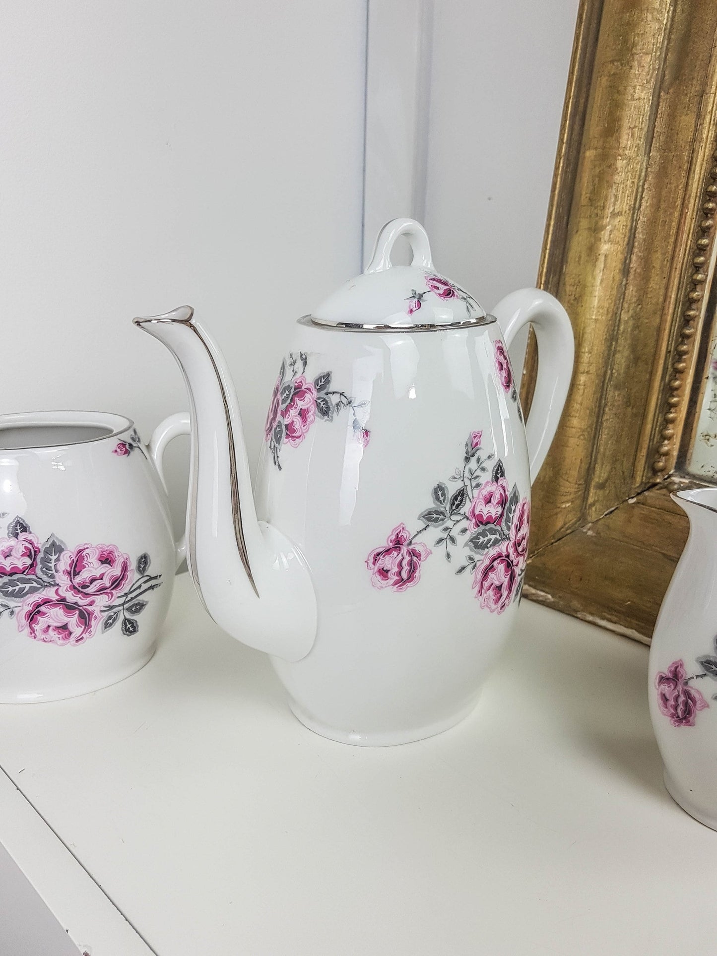 White porcelain tea set with floral pattern