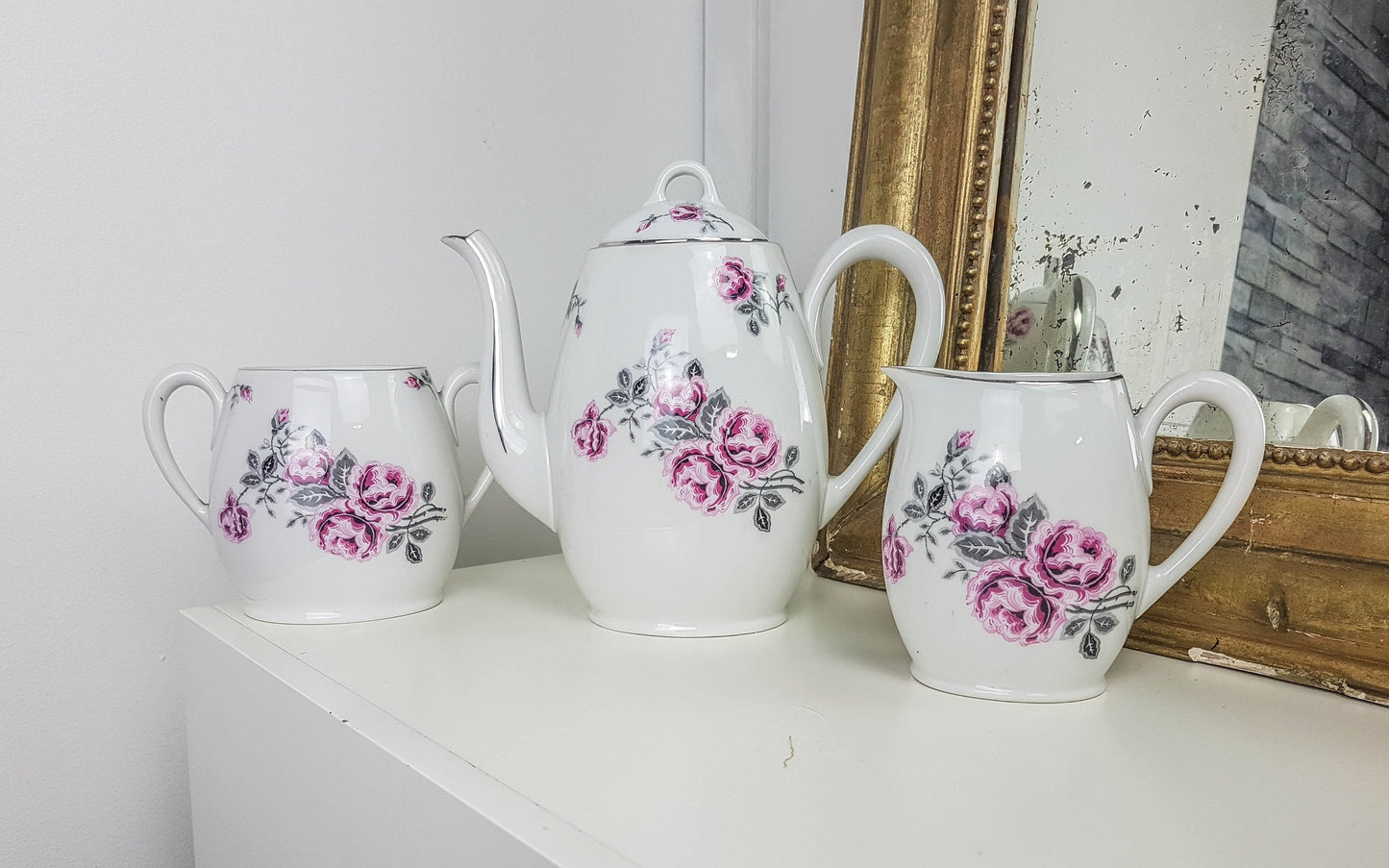 White porcelain tea set with floral pattern