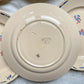 Lot de 8 assiettes plates en porcelaine vintage K&G Lunéville, modèle "Flore" des années 1950, décorées de petites fleurs bleues délicates.