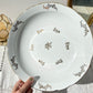 Plat creux en porcelaine blanche dorée J&Ciem France 1950 motif fleuri