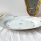 Plat oval en porcelaine blanche dorée J&Ciem France 1950 motif fleuri