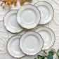 Ensemble de 6 assiettes creuses vintage en porcelaine blanche avec décor doré géométrique SPF, vaisselle ancienne élégante pour table rétro ou collection.